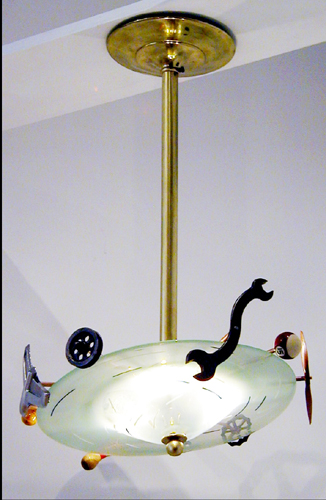 A contemporary chandelier of hand blown glass and found objects