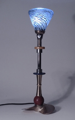 Optic Swirl 2023 is light sculpture by Harry Anderson in the form of a table lamp