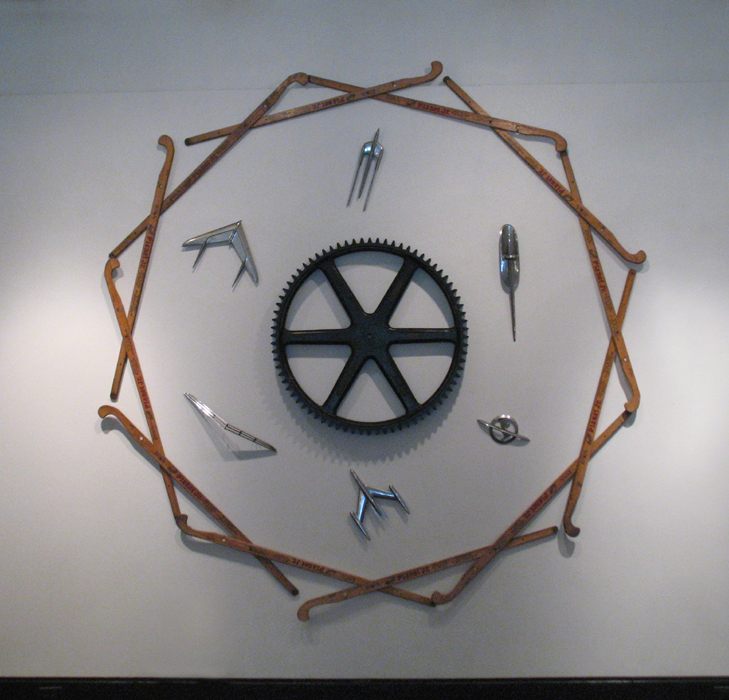 An installation by Harry Anderson titled Planet Jr that incorporates parts of farm from the Planet Junior company implements and car hood ornaments 